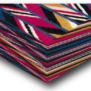 May include: A vibrant textile with a geometric pattern, incorporating red, blue, black, white, and gold stripes and chevron shapes. The fabric is folded, displaying the layered design and textures.