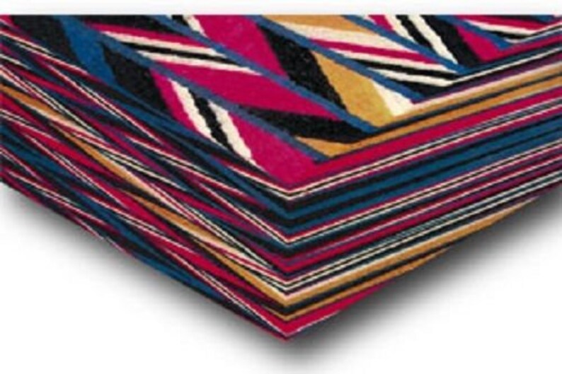 May include: A vibrant textile with a geometric pattern, incorporating red, blue, black, white, and gold stripes and chevron shapes. The fabric is folded, displaying the layered design and textures.