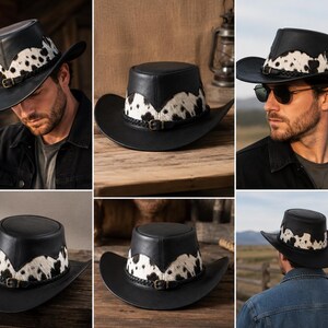 May include: A black leather cowboy hat featuring a white and black cowhide patterned band around the crown. The hat includes a braided leather hatband with a small metal buckle detail. The design has a flat top and a wide, curved brim.