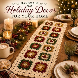 May include: A rectangular crochet table runner featuring a repeating pattern of granny squares in dark red, forest green, and mustard yellow, bordered by a cream-colored scalloped edge. The text HANDMADE Holiday Decor FOR YOUR HOME is visible.