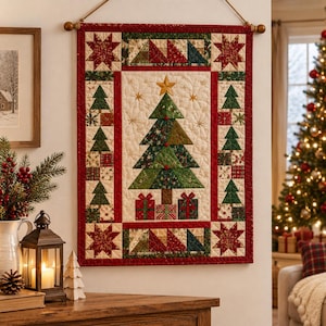 May include: A rectangular quilted wall hanging featuring a central Christmas tree design with presents underneath, surrounded by a border of smaller trees and star motifs in red, green, and cream fabric, suspended from a wooden rod with rope.