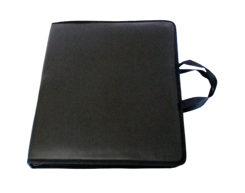 May include: Black portfolio case with a carrying handle. The case is made of a durable material and has a zipper closure.