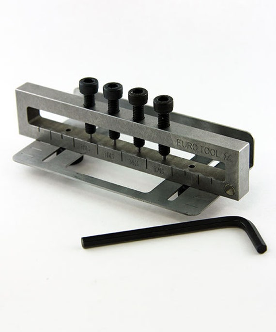 Deluxe Riveting 4-Hole Metal Punch – Cool Tools