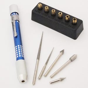 May include: A blue and silver rotary tool with a set of various drill bits and a black storage case with brass collets. The tool has a silver grip and a blue body with white dot accents.