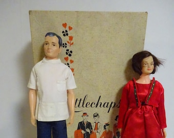 2 Littlechaps dolls, Dr John and daughter  Judy, in original case, with clothes, 1963