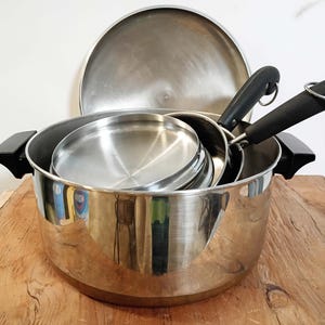 Revere Ware cookware 2 saucepans, 1 stock pot, each with lid