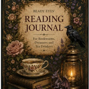 May include: A rectangular book titled BEADY EYES' READING JOURNAL For Bookworms, Dreamers and Tea Drinkers. The cover features a black raven, a lit lantern, a small dragon figurine, a teacup on a saucer, and stacked books with floral accents.