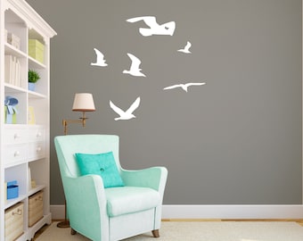 Siluetas de gaviotas volando en bandada - Vinilos decorativos personalizados