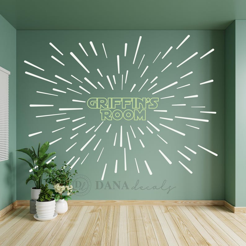May include: A green wall with a white starburst design and the text "Griffin's Room" in a light green color. The wall decal is a fun and easy way to personalize a child's room.