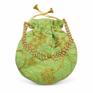 May include: A light green drawstring pouch featuring intricate gold thread embroidery in a floral vine pattern. The bag is accented with a multi-strand pearl bead handle and a drawstring closure topped with gold-toned metal conical end caps.