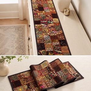May include: A rectangular table runner featuring a patchwork design composed of numerous small, square fabric panels. The runner displays a variety of intricate patterns, metallic threads, and deep colours including red, gold, and black.