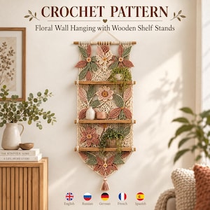 May include: A crochet pattern for a floral wall hanging with wooden shelf stands. The design features cream-coloured macrame netting adorned with crocheted flowers and leaves in shades of sage green, dusty rose, and tan, suspended from a wooden rod.