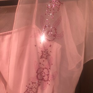 Pink knee length 70s dress with floral glitter design
