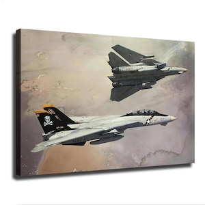 May include: A canvas print featuring two grey F-14 Tomcat fighter jets in flight against a cloudy sky. The lower jet displays a black tail fin with a white skull and crossbones emblem, the text VF-84, and the number 201 on the fuselage side.