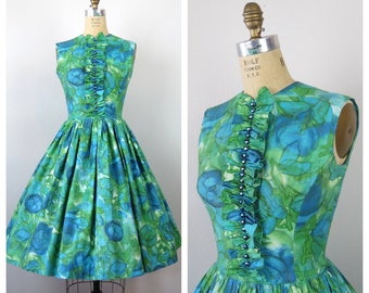 Vintage 1960s floral dress cotton fit and flare green sleeveless sundress ruffle front full skirt