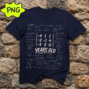 May include: A navy blue short-sleeve t-shirt featuring a white graphic print of various mathematical formulas, geometric shapes, and a central matrix with the text "-4 1 1 -2 -1 4 -9 5 0 YEARS OLD" printed in a bold, white, sans-serif font.