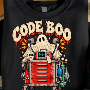 May include: A black sweatshirt featuring a graphic of a white ghost holding defibrillator paddles above a red medical crash cart. The text CODE BOO is printed in large, distressed beige letters. The design includes a stethoscope, oxygen tank, and monitor.