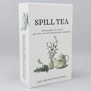 May include: A white rectangular card deck box titled Spill Tea. The front features a teapot, teacup, and sprigs of herbs with the text: Curious about the truth? Let's spill tea and uncover what's brewing! A 80-card deck with keywords.