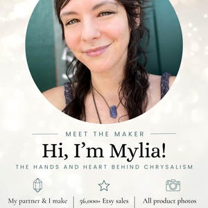 May include: A portrait of Mylia with dark wavy hair and a crystal pendant necklace. Text reads: MEET THE MAKER, Hi, I&rsquo;m Mylia!, THE HANDS AND HEART BEHIND CHRYSALISM, My partner & I make every piece by hand in Boulder, Colorado, 56,000+ Etsy sales since 2011, 4.9 star average, All product photos taken by me &mdash; never AI-generated, THANKS FOR SUPPORTING OUR LITTLE STUDIO!