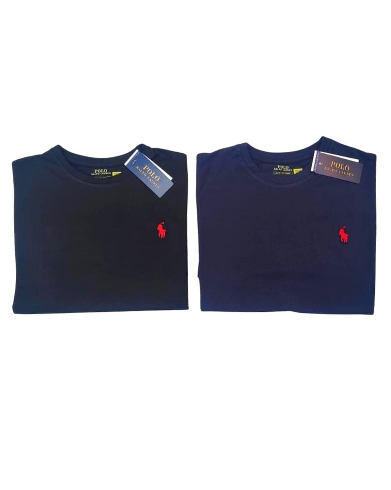May include: Two navy blue crew neck t-shirts with short sleeves. Each shirt features a small red embroidered Polo Ralph Lauren horse logo on the left chest. Both shirts include a white and blue Polo Ralph Lauren brand tag attached to the collar.