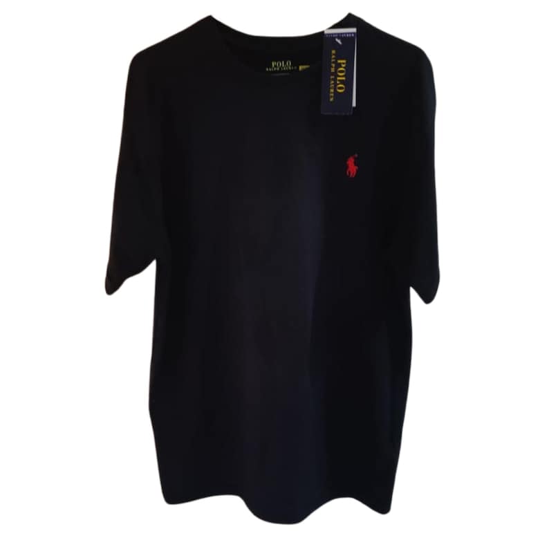 May include: A solid black short-sleeve t-shirt featuring a small red embroidered logo of a person on a horse on the left chest. The shirt includes a dark blue brand tag attached to the collar and a printed brand label on the inside neck area.