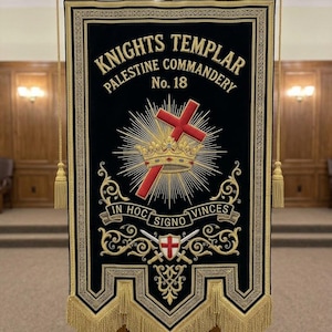 May include: A black velvet banner featuring gold embroidered text reading Knights Templar Palestine Commandery No. 18. The center displays a red cross behind a gold crown with rays, above a banner with In Hoc Signo Vinces and crossed swords.