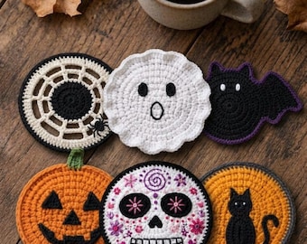 May include: A set of six crocheted coasters featuring Halloween designs: a black and white spider web, a white ghost, a black bat, an orange pumpkin, a white sugar skull with floral details, and an orange circle with a black cat silhouette.