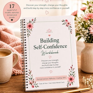 May include: A spiral-bound workbook titled Building Self-Confidence Workbook with floral accents. The cover features text including Discover your strength, change your thoughts and build step by step more confidence in yourself, and Cindy de Vries.