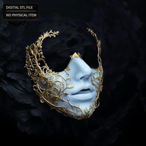 May include: A digital STL file of a mask featuring a pale blue facial structure adorned with intricate gold filigree patterns that extend across the cheeks and forehead. The text DIGITAL STL FILE NO PHYSICAL ITEM is visible in the upper left corner.