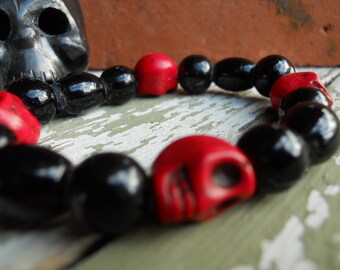 The Real Dia de Los Muertos Cardinal Colors Skull bracelet in University of Louisville colors red and black