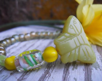 Bracelet stretch with handcarved jade butterfly and lampwork glass beads, vintage German beads