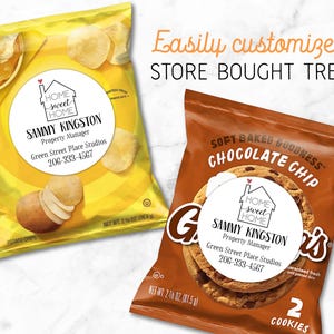 Two snack packages shown, one Potato Chips and one Chocolate Chip Cookies.  Each has a matching round white label attached to the front.  Label design: 'Home Sweet Home' inside a simple house outline, with a small red heart coming out of the chimney.  Labels are personalized at the bottom with professional contact info Name/Title/Company/Phone#/Email.  Overlay text: 'Easily customize store bought treats'