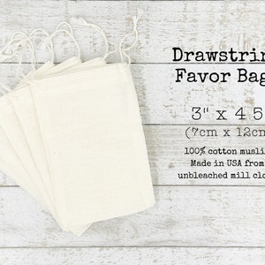 May include: A stack of 10 white cotton drawstring favor bags, 3 inches by 4.5 inches (7cm x 12cm), made from unbleached muslin. The bags are made in the USA. Drawstring Favor Bags 3" x 4.5" (7cm x 12cm) 100% cotton muslin Made in USA from unbleached mill cloth