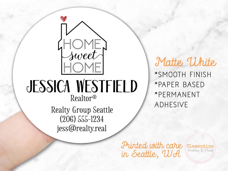 Round label is shown stuck on a fingertip.  Overlay text: ‘Matte White: Smooth finish, paper based, permanent adhesive. Printed with care in Seattle WA by Clementine Wedding & Party.'