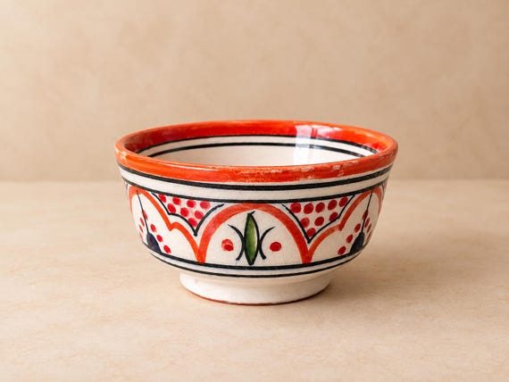 A hand-painted Moroccan ceramic bowl with authentic artisan detail — the kind of visually arresting piece that instantly elevates a kitchen or dining table and sparks conversation.