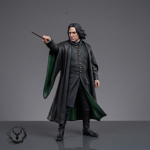 May include: A detailed figurine of a person with shoulder-length black hair, wearing a long black coat with a green interior lining and a row of brass-colored buttons. The figure holds a thin brown wand extended forward in a pointing gesture.