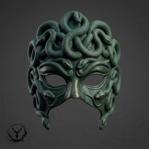 May include: A dark green mask featuring a sculpted design of multiple intertwined snakes covering the entire surface. The snakes are arranged to form the structure of the mask, with their heads and bodies creating a textured, layered appearance.