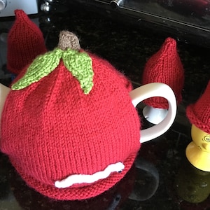 The apple and the worm tea cozy and egg hats