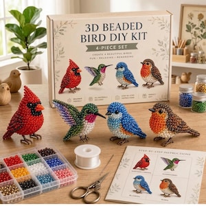 May include: A 3D beaded bird DIY kit featuring a box labeled 3D BEADED BIRD DIY KIT 4-PIECE SET, four finished beaded bird figures, a plastic organizer with colorful beads, a spool of clear thread, metal scissors, and an instruction sheet.