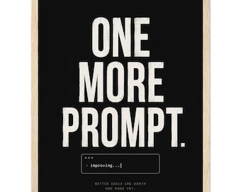 May include: A framed wall art print featuring a black background with the white text ONE MORE PROMPT. Below this, a small box displays the text > improving... followed by the smaller text BETTER IDEAS ARE WORTH ONE MORE TRY and a code bracket icon.