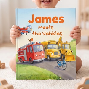 May include: A hardback children's book titled James Meets the Vehicles, featuring a red fire engine, a yellow school bus, a yellow excavator, a blue bicycle, and a small red aeroplane on the cover, all illustrated with friendly faces.