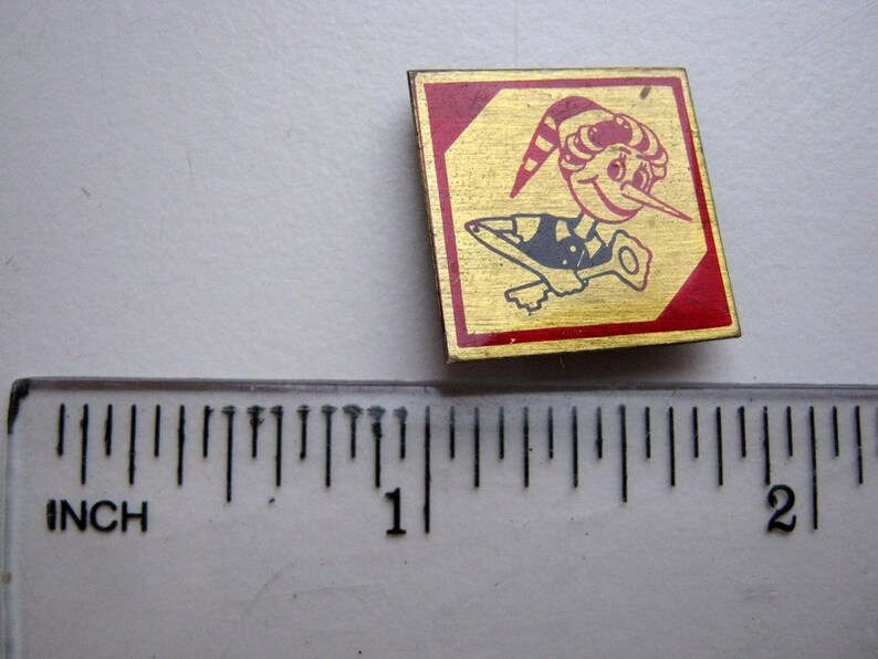 Small vintage soviet pin badge Buratino Pinocchio in acceptable condition