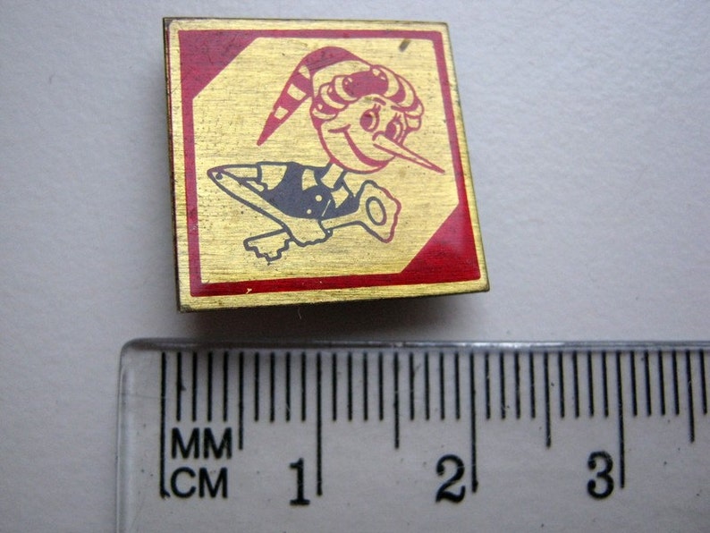 Small vintage soviet pin badge Buratino Pinocchio in acceptable condition