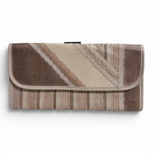May include: A rectangular wallet featuring a flap closure with a textured, multi-tonal brown and beige pattern. The design incorporates alternating vertical stripes and diagonal sections with a reptilian-like embossed finish in neutral earth tones.