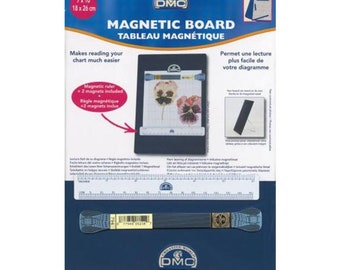 May include: A navy blue DMC magnetic board for cross-stitch charts, measuring 7 x 10 inches (18 x 26 cm). Includes a magnetic ruler and two magnets. The board features the text "MAGNETIC BOARD" and "Makes reading your chart much easier."