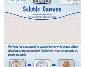 May include: DMC Soluble Canvas, a white water-soluble fabric for cross stitch. The package shows a white canvas, a hoop with a stitched design, a bowl of water with a stitched design, and a stitched teddy bear.  The text on the package reads "Soluble Canvas, Water Soluble Canvas, Toile à Broder Soluble dans l'eau".