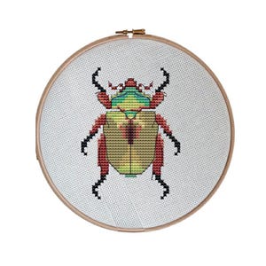 Zestaw do haftu krzyżykowego „Christmas Beetle”: Aida, nić, tamborek (14/16/18 ct)