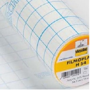 May include: A roll of white, translucent, gridded film with a yellow label that reads "Filmoplast H 54" and includes the text "70% CV, 30% Woven 54, 5 cm, 13 m".