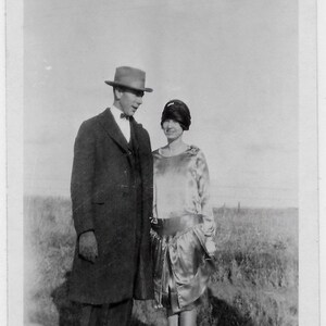 Old Photo Dressed Up Couple Woman wearing Dress Cloche Hat Man Suit Coat Hat 1920s Photograph Snapshot vintage