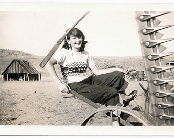 Old Photo Girl sitting on Farm Tractor wearing Sweater with Zig Zag Pattern 1940s Photograph Snapshot Vintage